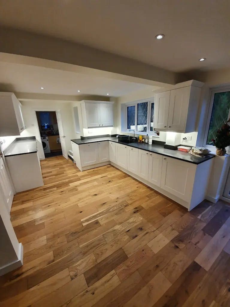Repainted shaker kitchen with oak floor